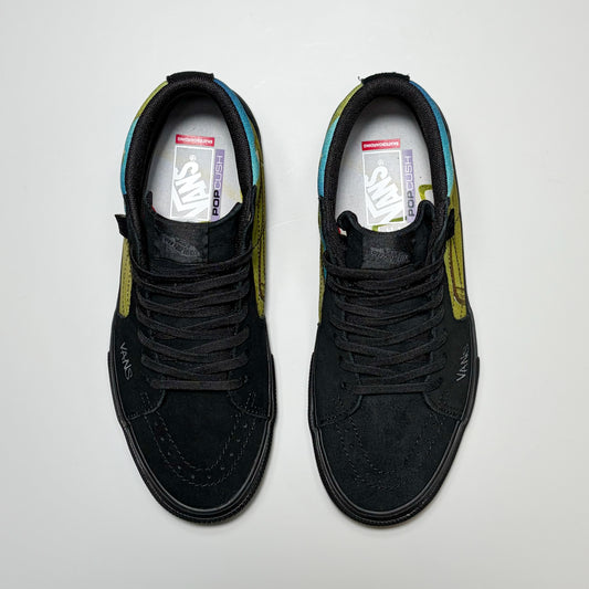 A pair of black Vans Skate Sk8-Hi by Atiba Jefferson. Shown from a top-down view on a light gray background.