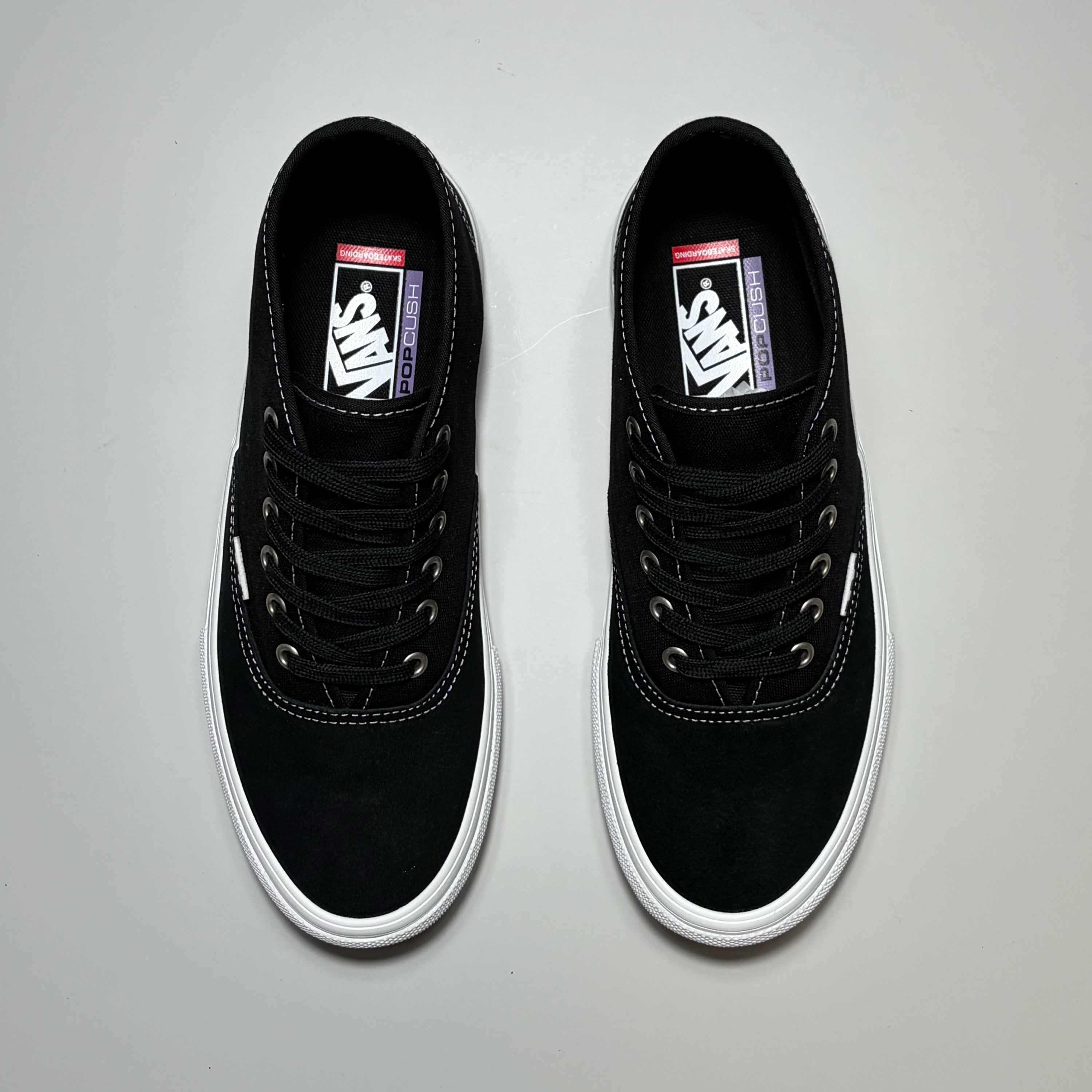 A pair of black Vans Skate Authentic Mic sneakers with white rubber soles, shown from a top-down view on a light gray background.