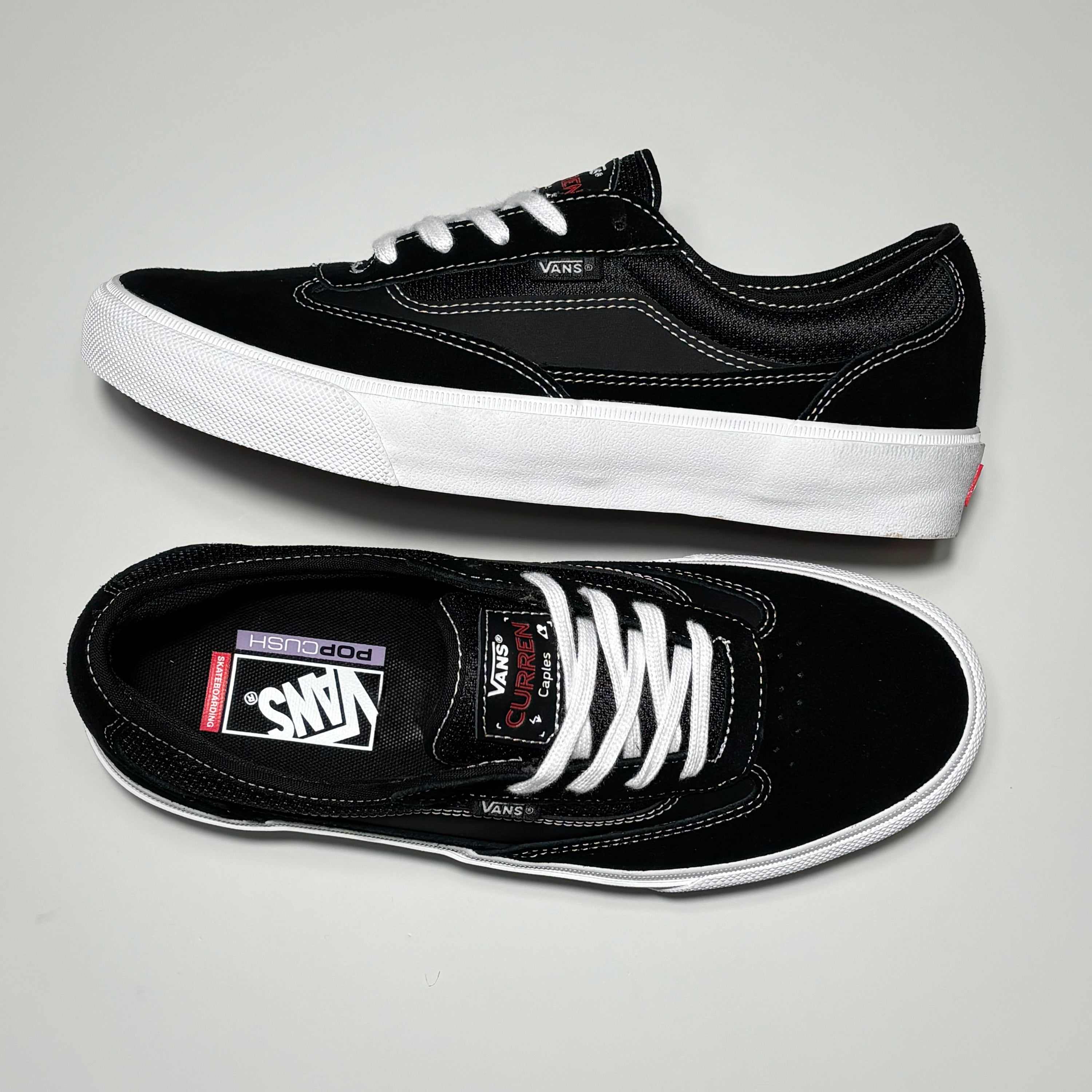 Toe down view with side profile.
Vans Curren branding on tongue.