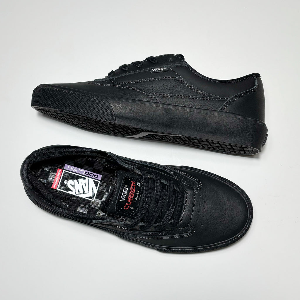 Toe down view with side profile.
Embossed leather patch on tongue.