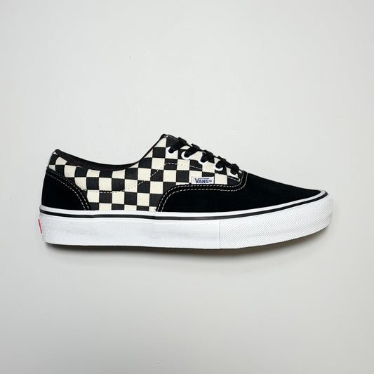 Right side image, Vans Skate Era Checkerboard sneaker. Black suede toe and heel panel with white outsole