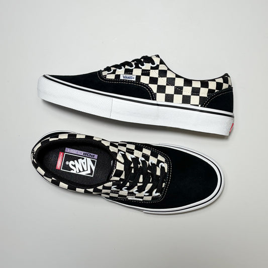 A pair of Vans Skate Era sneakers in black and white checkerboard canvas, shown from both side and top-down angles on a light gray background.