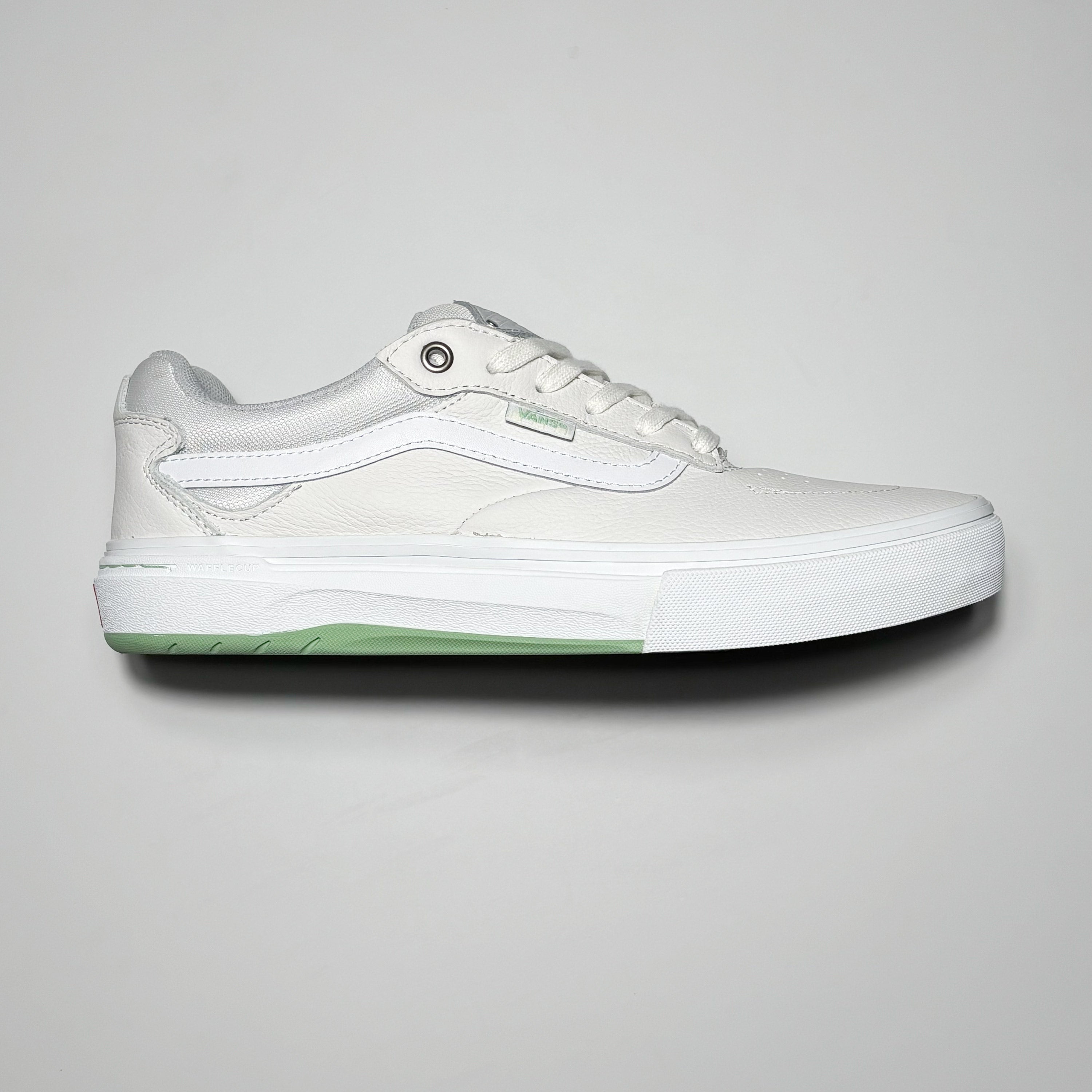 Side image of right shoe. White leather with white outsole.