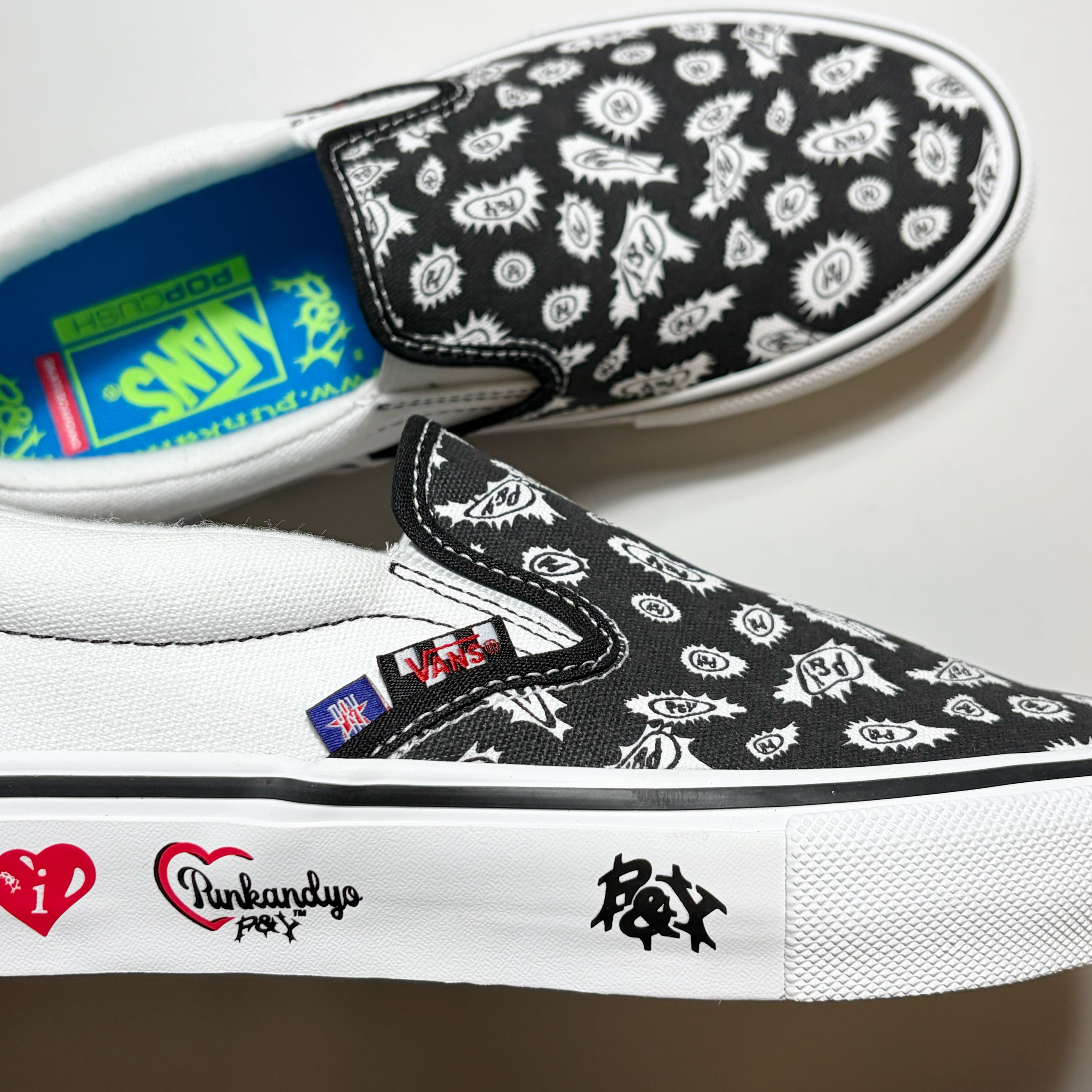 Close detail of Vans Skate Slip On, Punk and Yo branding on white sidewall of the shoe.