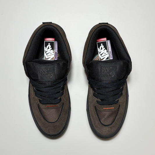 A pair of Vans Skate Half Cab Wafflecup Dick Rizzo sneakers in dark brown suede and black mesh, viewed from directly above on a light gray background