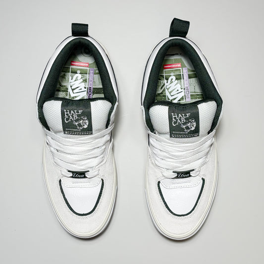 Toe down view of Vans Skate Half Cab Wafflecup Shoes by Una Farrar. White laces with green woven label on tongue.