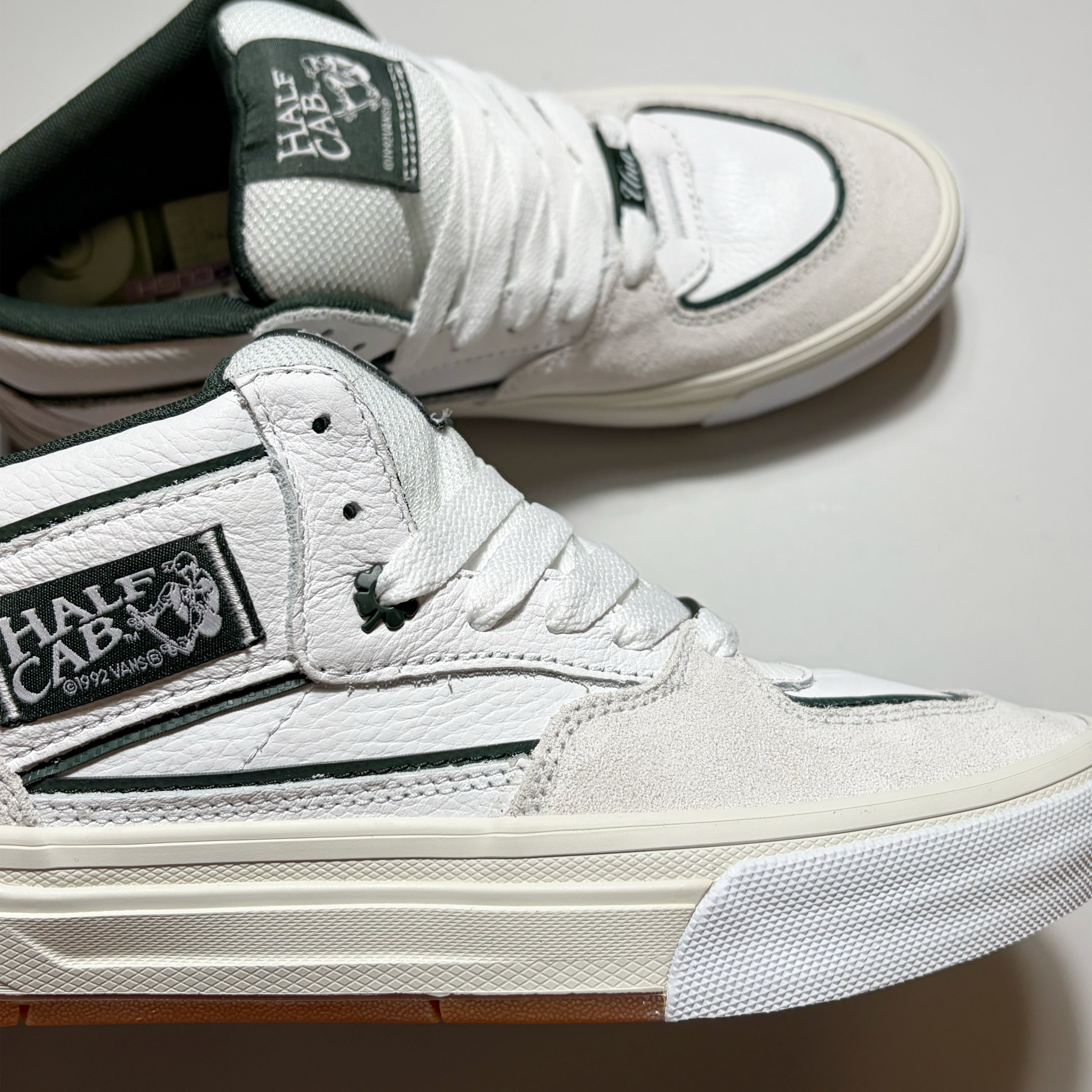 Close details of shamrock eyelet and woven half cab label.
