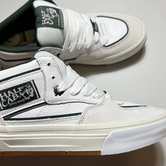Close details of shamrock eyelet and woven half cab label.
