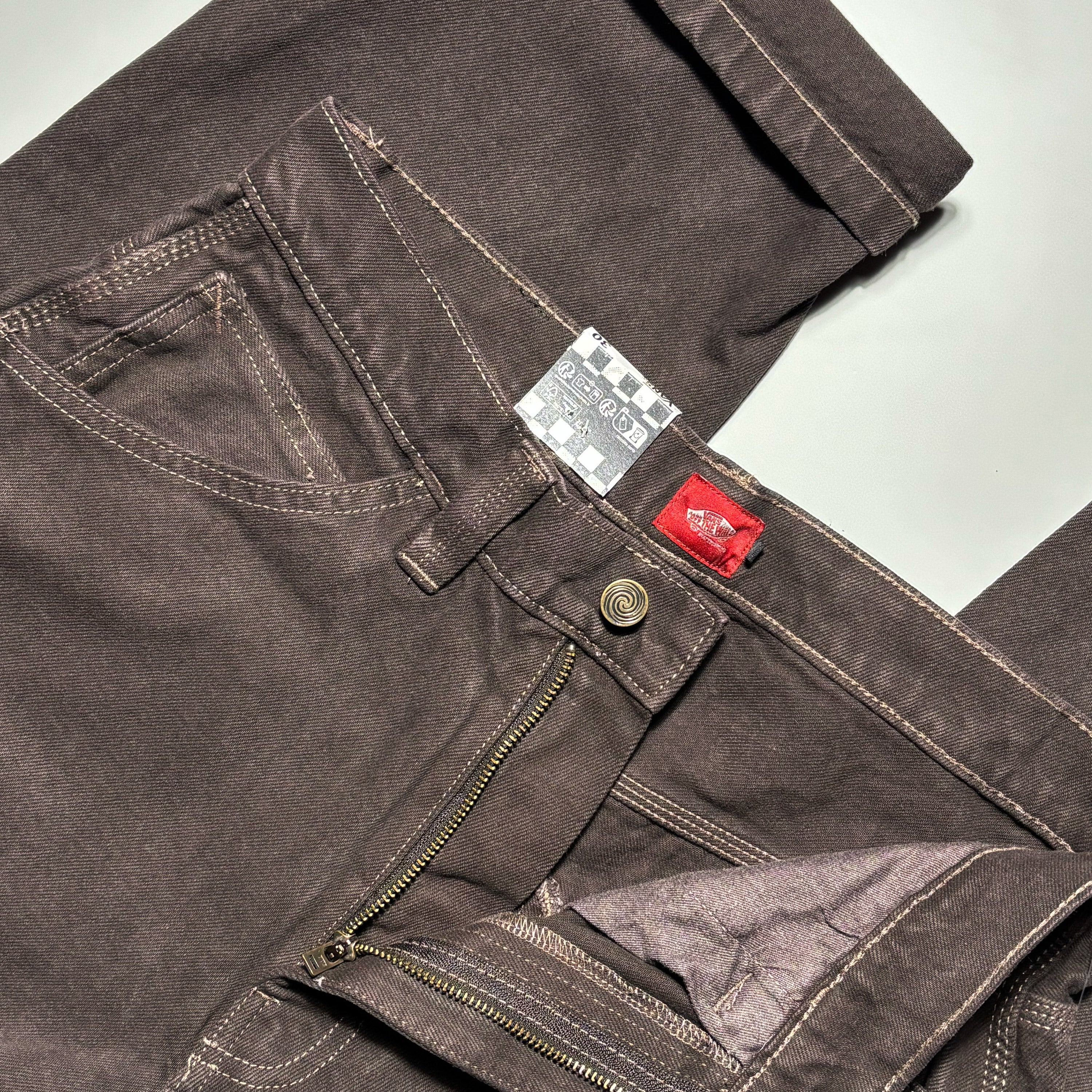 Close detail of denim wash and contrast stitching.