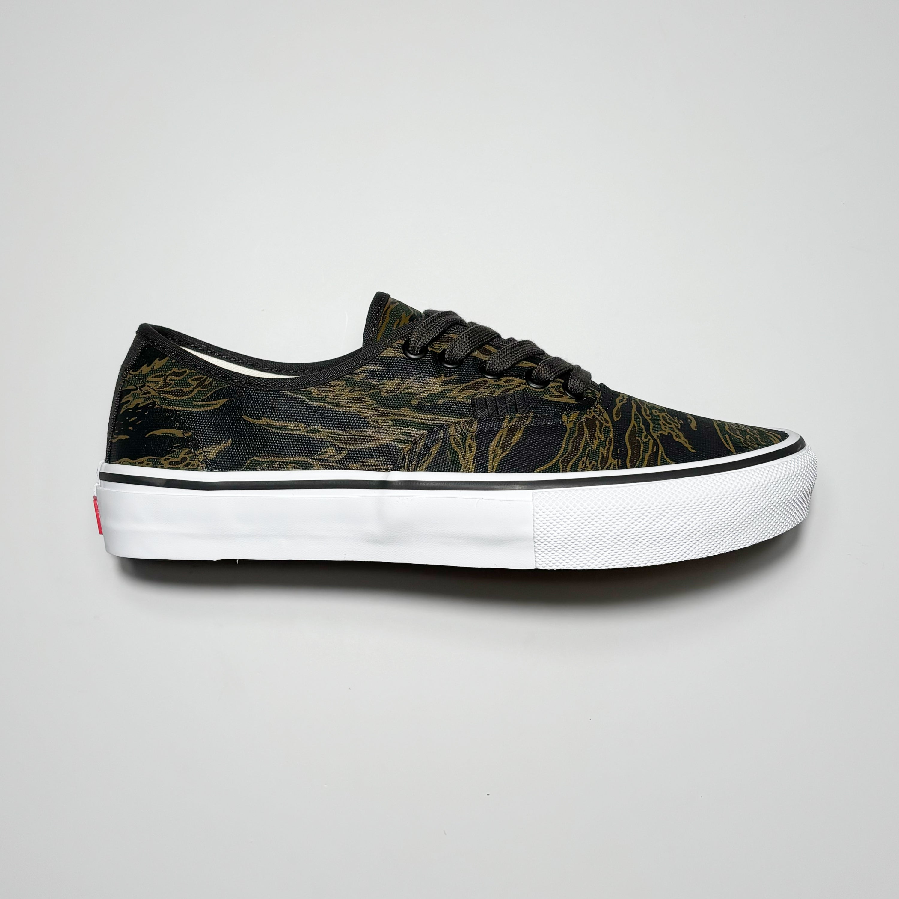 Side image of right shoe. Tiger camo printed canvas.