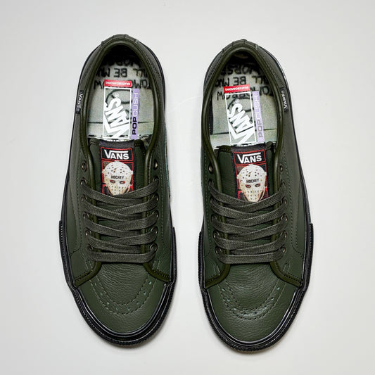 Toe down view of both shoes. Green laces, custom tongue with Hockey Skateboards art.