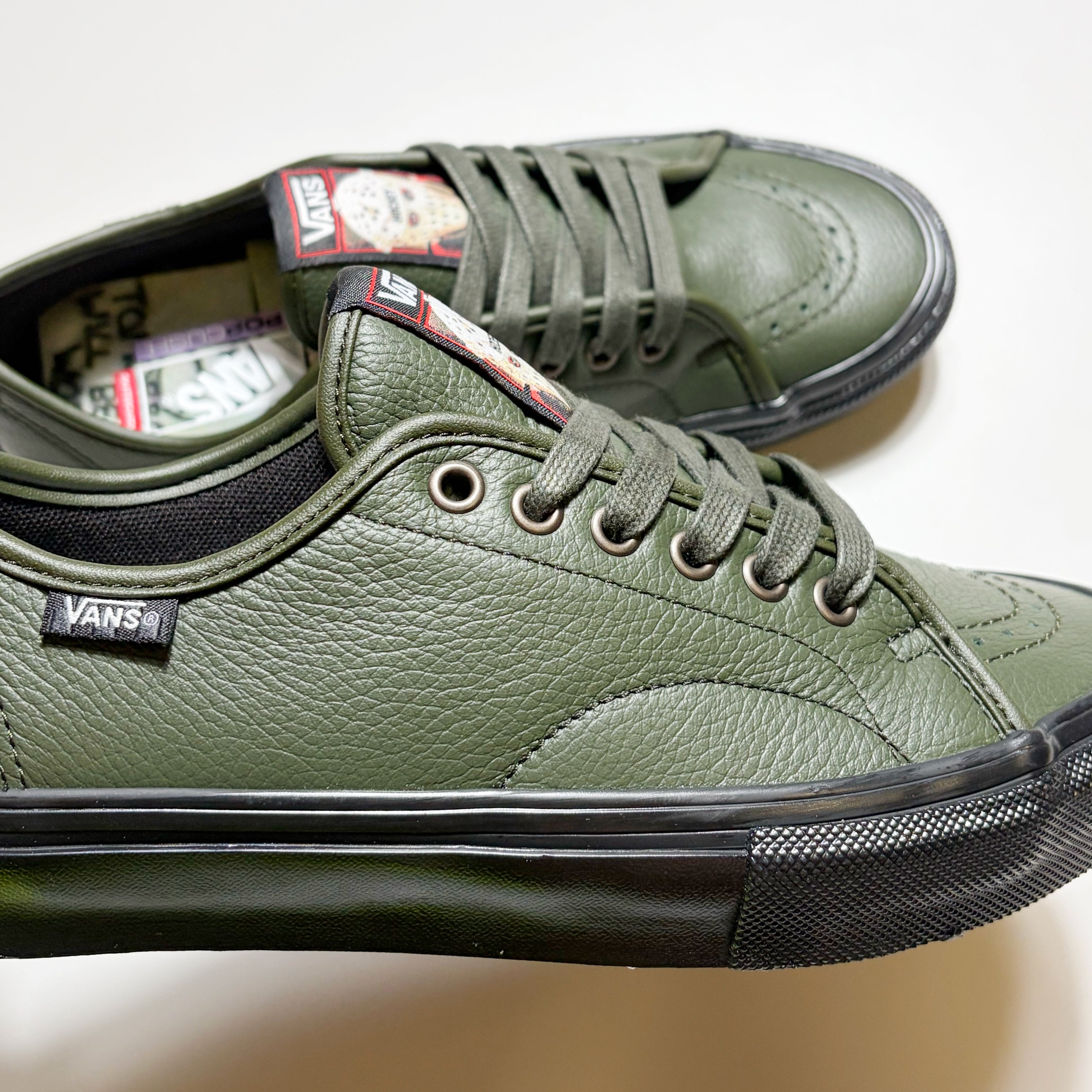 Close detail of Vans VCU AVE Classic shoe. Premium green leather with green laces and black midsole.