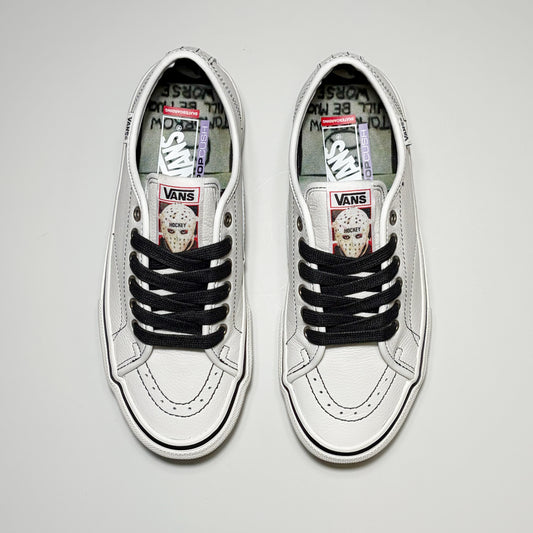 Toe down view of both shoes. Black laces, custom tongue with Hockey Skateboards art.