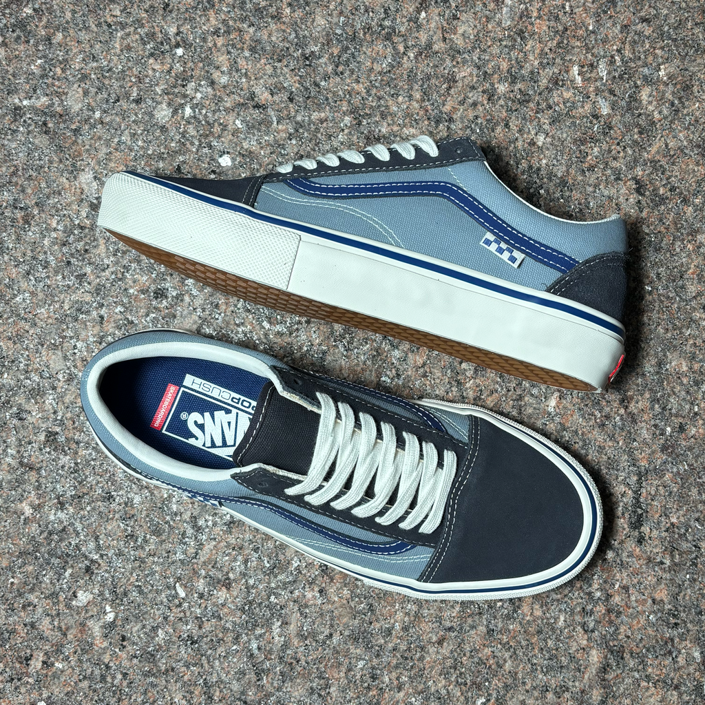 Toe down view with side profile. 2 tones of blue with white laces. 