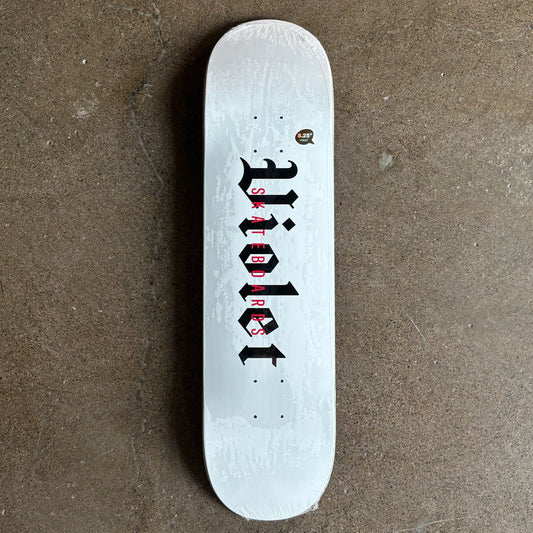 Full image of skateboard deck. White with black violet font in black.