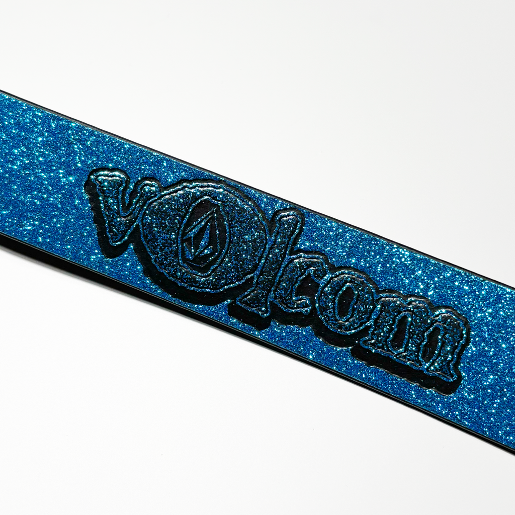 Volcom logo embossed on back of belt.