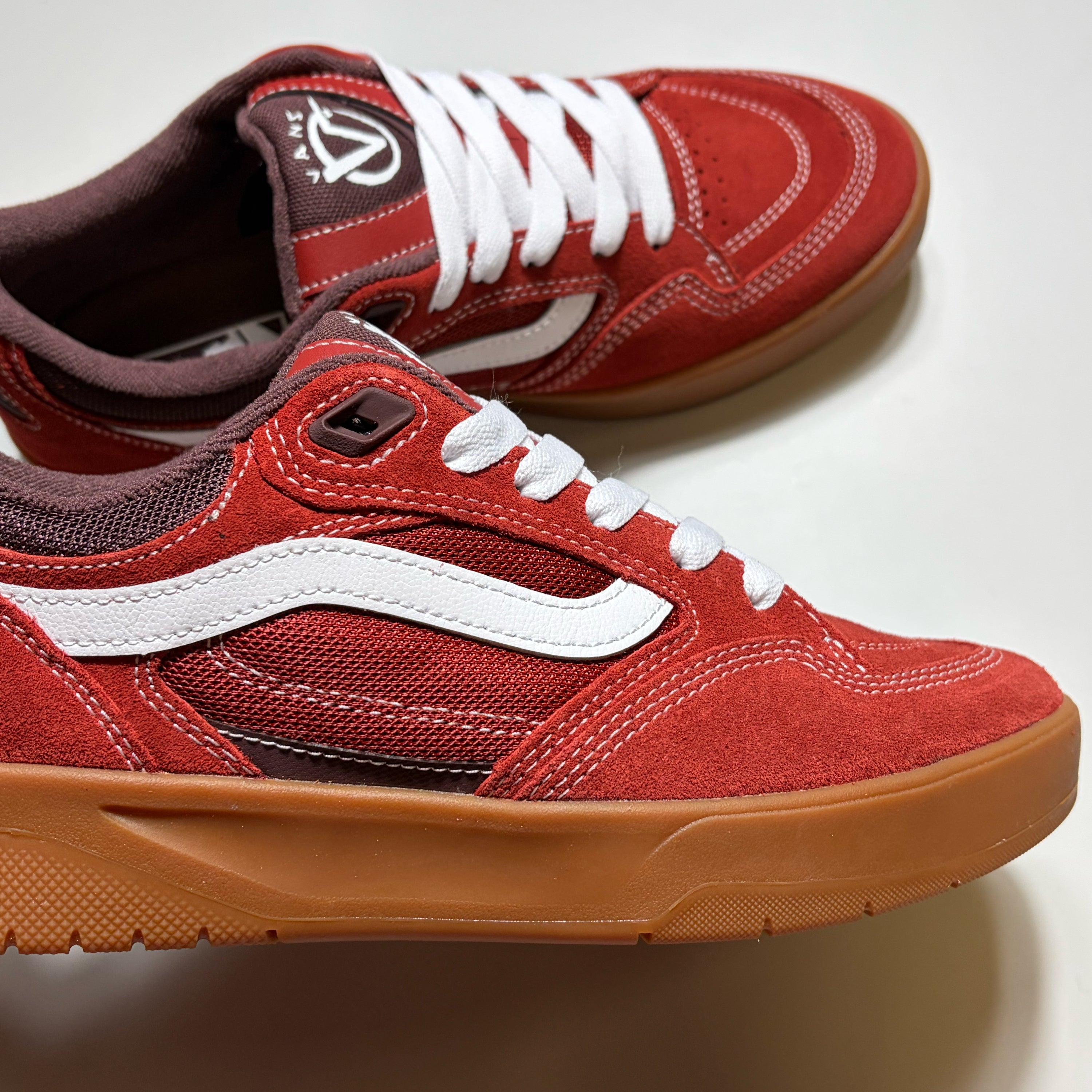 Close detail of Vans Rowan Z3 in red suede with mesh mid panel. 