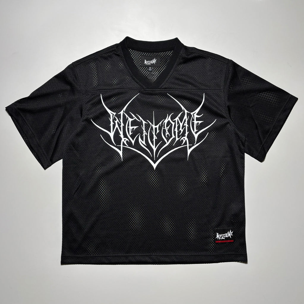 Front image of black jersey with printed art on chest