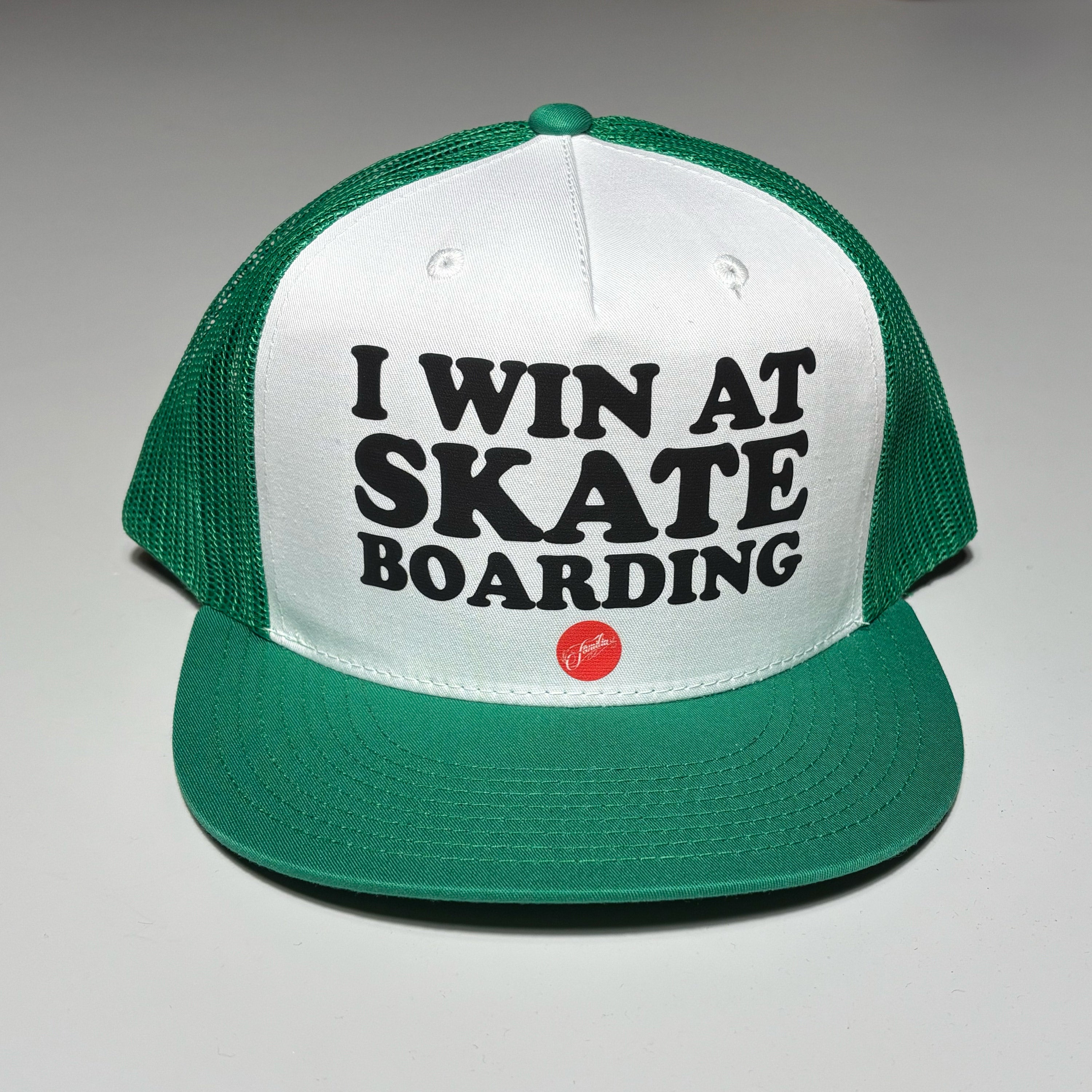 Front image of green mesh hat with I WIN AT SKATEBOARDING on crown.