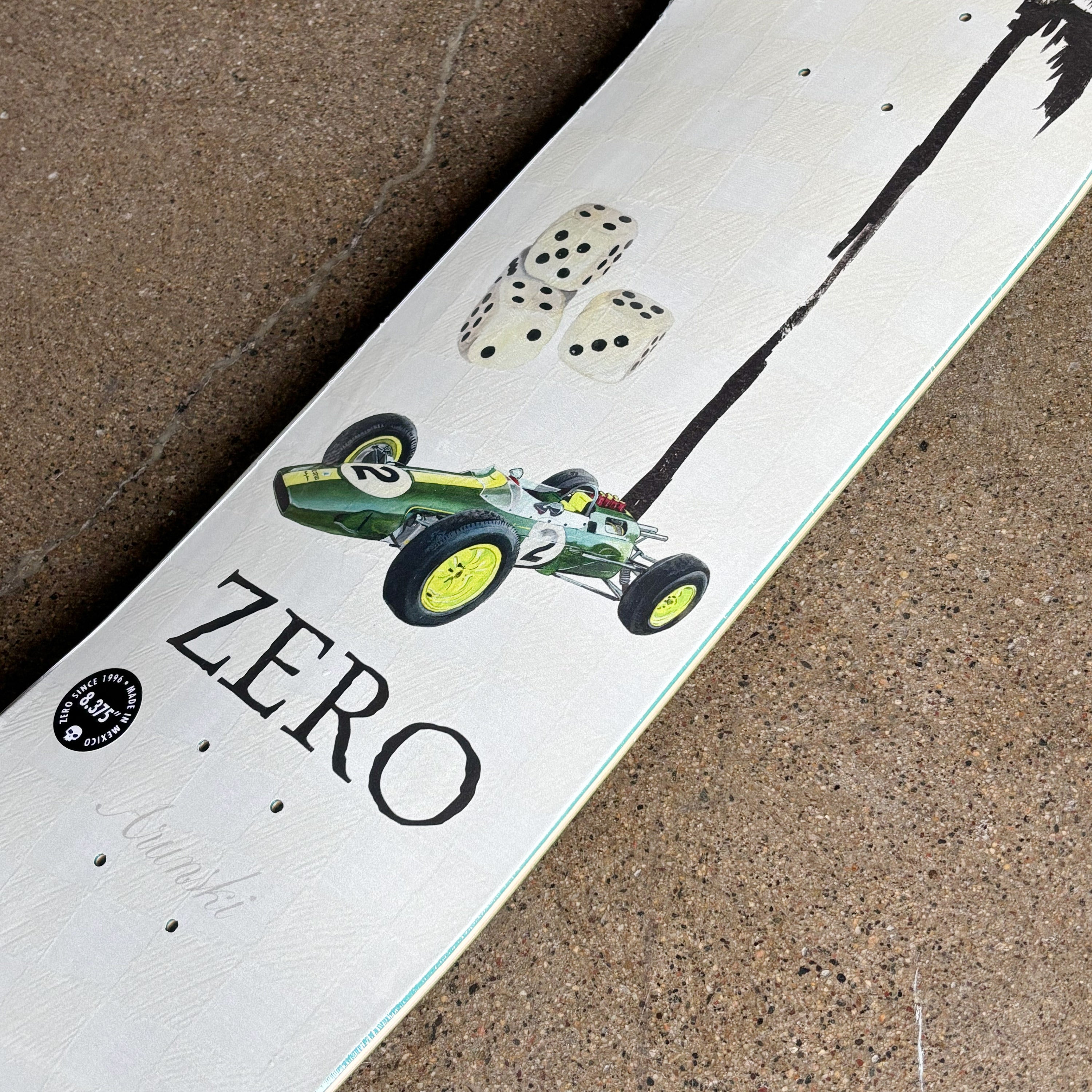 Close detail of racing car design and 'Zero' branding on a textured surface.