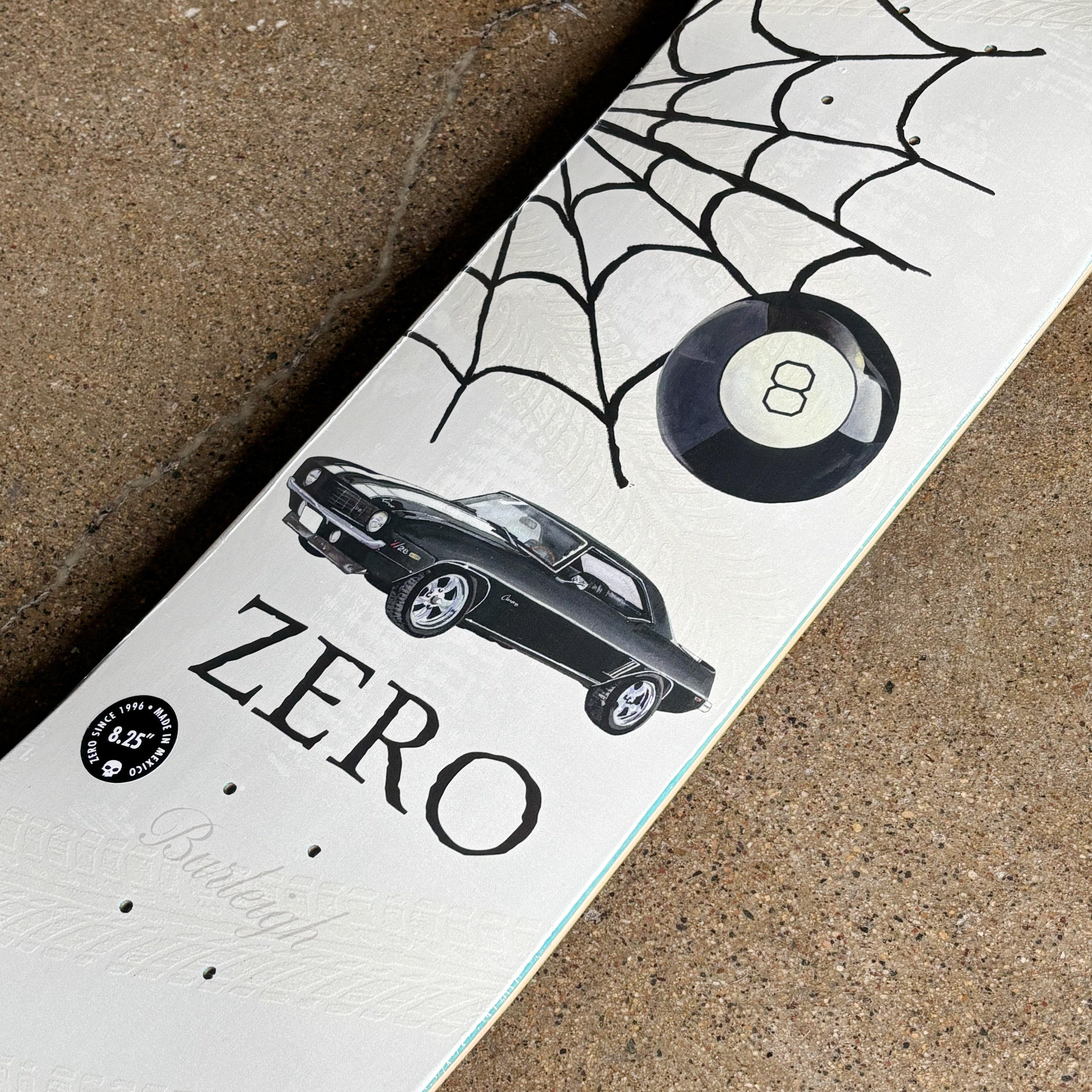 Close detail of web and car with eight ball art.